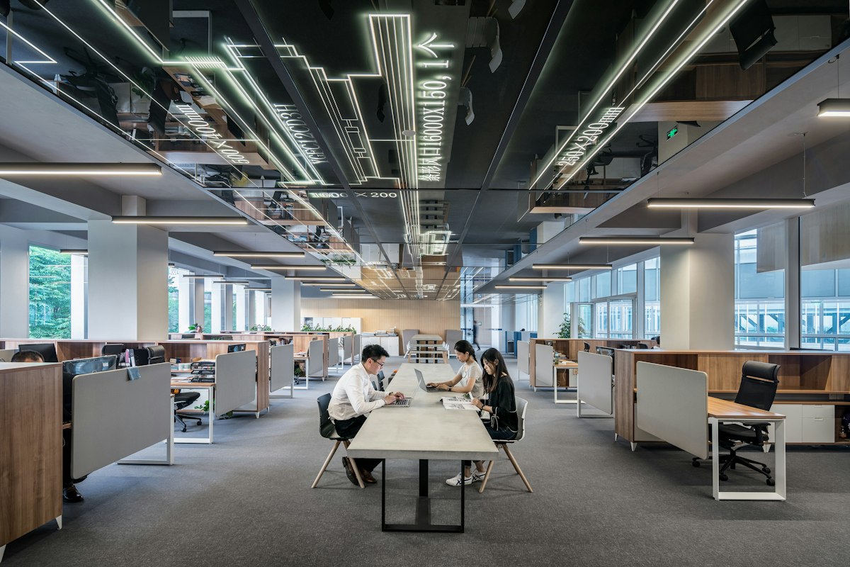 Modern open-plan office where teams use connected Microsoft tools