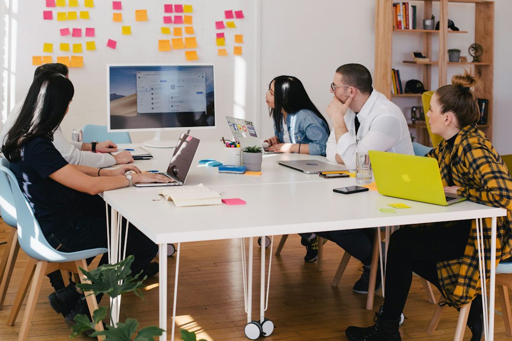 Team mapping a workflow with sticky notes